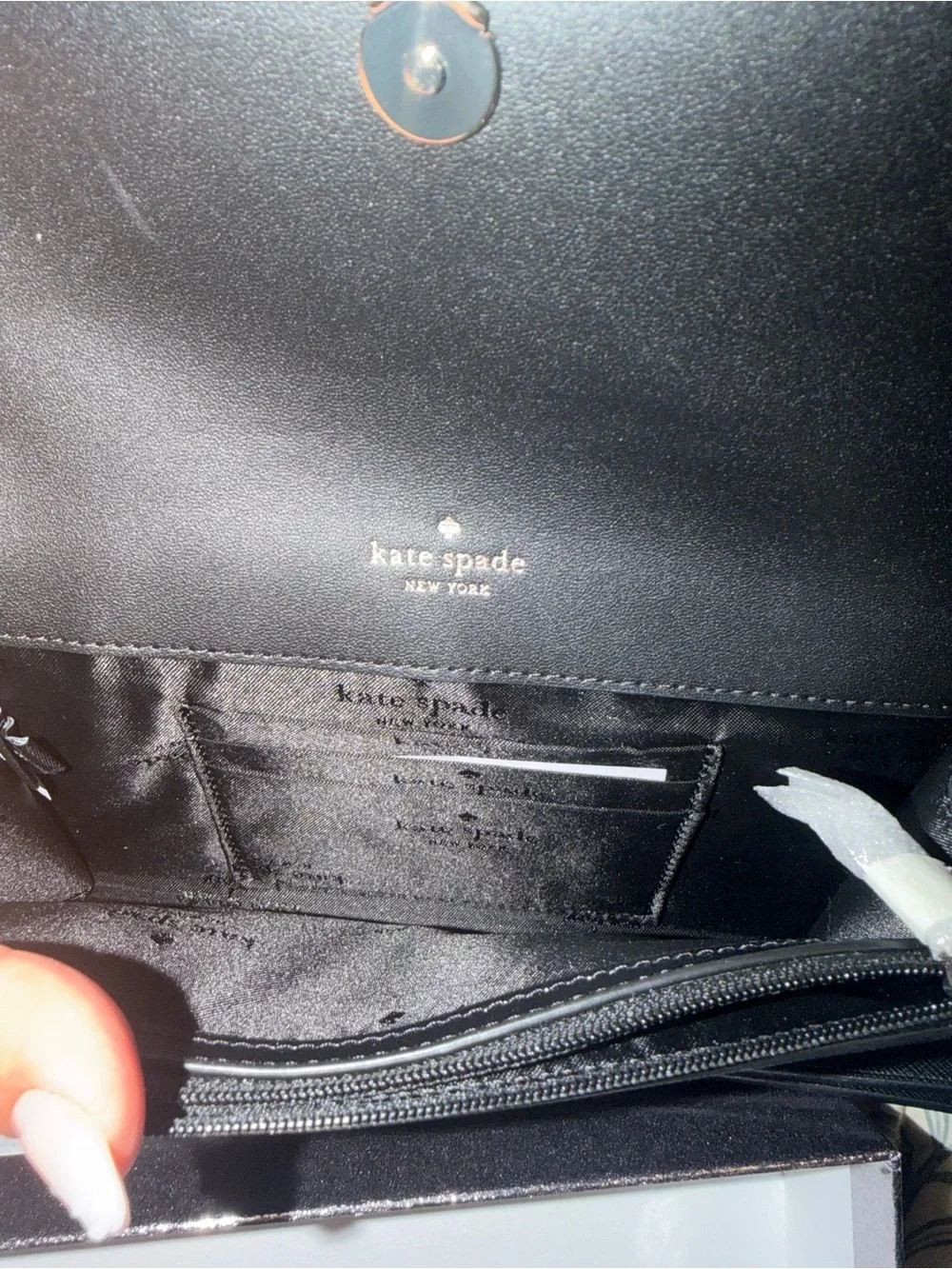 kate spade black saffiano leather flap wallet with gold plaque